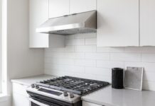Best 30 Inch Ductless Range Hood: Top Picks & Buying Tips 30 inch ductless range hood installed under a cabinet above a stove in a modern kitchen