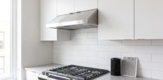 Best 30 Inch Ductless Range Hood: Top Picks & Buying Tips 30 inch ductless range hood installed under a cabinet above a stove in a modern kitchen
