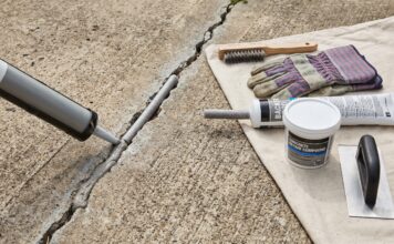Best Concrete Crack Filler for Driveways, Patios & Large Cracks Concrete crack filler applied to a driveway crack with repair tools nearby