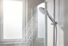 Best Handheld Shower Head With Hose for Stronger Spray & Easy Cleaning Handheld shower head with hose spraying strong water in a modern bathroom