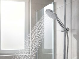 Best Handheld Shower Head With Hose for Stronger Spray & Easy Cleaning Handheld shower head with hose spraying strong water in a modern bathroom