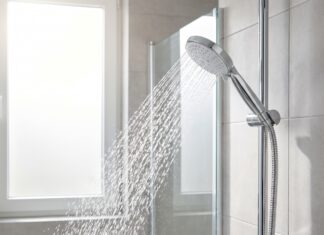 Best Handheld Shower Head With Hose for Stronger Spray & Easy Cleaning Handheld shower head with hose spraying strong water in a modern bathroom
