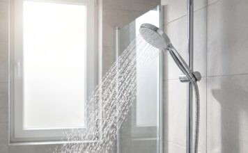 Best Handheld Shower Head With Hose for Stronger Spray & Easy Cleaning Handheld shower head with hose spraying strong water in a modern bathroom