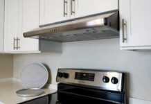 Best Range Hood for Apartment Kitchen: Ductless & No-Vent Options Ductless under-cabinet range hood installed above a stove in a small apartment kitchen