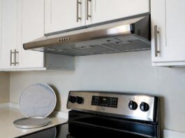 Best Range Hood for Apartment Kitchen: Ductless & No-Vent Options Ductless under-cabinet range hood installed above a stove in a small apartment kitchen