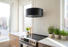 Kitchen Ductless Range Hoods: Best Options, Pros, Cons & Buying Tips Modern ductless range hood installed above a stove in a bright apartment kitchen