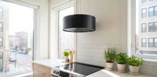 Kitchen Ductless Range Hoods: Best Options, Pros, Cons & Buying Tips Modern ductless range hood installed above a stove in a bright apartment kitchen