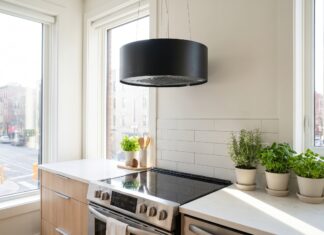 Kitchen Ductless Range Hoods: Best Options, Pros, Cons & Buying Tips Modern ductless range hood installed above a stove in a bright apartment kitchen