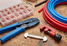 PEX Crimp Tool: Best Kits, Sizes, How to Use & Buying Tips PEX crimp tool kit with copper crimp rings, cutter, gauge, and PEX pipe on a workbench
