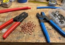 PEX Crimp vs Clamp: Which Connection Is Better? PEX crimp and clamp tools with copper crimp rings and stainless steel cinch clamps on a workbench