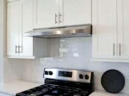 Under Cabinet Ductless Range Hood: Buying Tips, Filters & Installation Under cabinet ductless range hood installed above a stove in a modern apartment kitchen