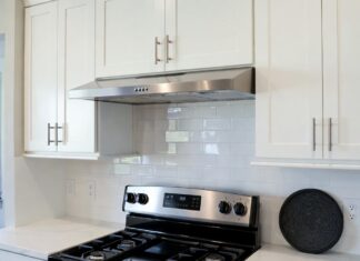Under Cabinet Ductless Range Hood: Buying Tips, Filters & Installation Under cabinet ductless range hood installed above a stove in a modern apartment kitchen