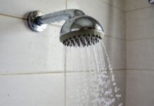 What Makes a Shower Head High Pressure? Spray Force, GPM & Nozzles Chrome shower head spraying focused water streams in a modern bathroom