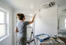 Mold Resistant Paint: Best Uses, Bathroom Tips & 7 Mistakes to Avoid Mold resistant paint being applied in a bathroom with clean walls, ceiling, and ventilation fan