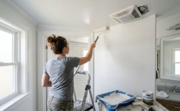 Mold Resistant Paint: Best Uses, Bathroom Tips & 7 Mistakes to Avoid Mold resistant paint being applied in a bathroom with clean walls, ceiling, and ventilation fan