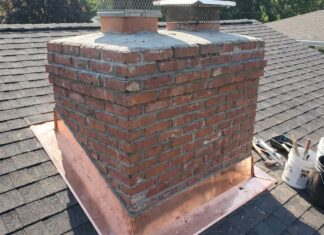 Chimney Repair: Costs, Warning Signs, Flashing, Crown & Brick Fixes Chimney repair showing damaged brick, flashing, crown, and masonry above a residential roof