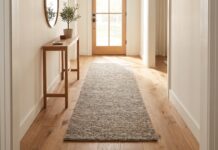 Entryway Runner Rug: Best Sizes, Materials & Hallway Ideas Entryway runner rug in a long hallway foyer with console table and plants