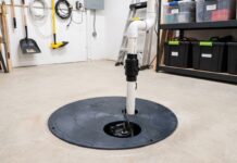 Sump Pump Cost: Installation, Replacement & 7 Price Mistakes to Avoid Basement sump pump installed in a sump basin with discharge pipe and check valve