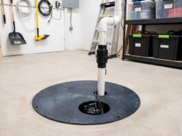 Sump Pump Cost: Installation, Replacement & 7 Price Mistakes to Avoid Basement sump pump installed in a sump basin with discharge pipe and check valve