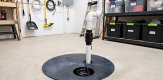 Sump Pump Cost: Installation, Replacement & 7 Price Mistakes to Avoid Basement sump pump installed in a sump basin with discharge pipe and check valve