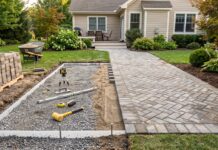 Paver Patio Cost in 2026: Price per Square Foot, Materials & Installation Professional paver patio installation showing finished patio and compacted base preparation